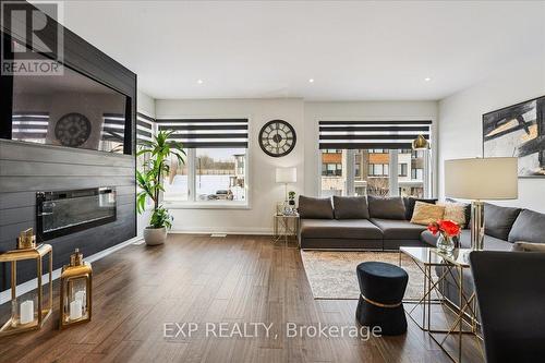Large Bright Family Room - 29 Briar Court, Halton Hills, ON - Indoor Photo Showing Living Room With Fireplace