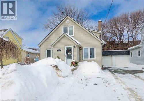 Bungalow-style home with a chimney, a garage, and an outdoor structure - 1170 Union Street, Kitchener, ON - Outdoor