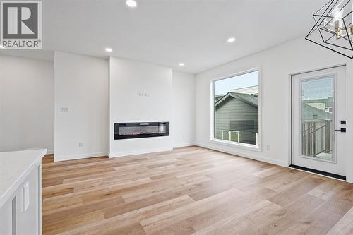 383 Caledonia Boulevard W, Lethbridge, AB - Indoor With Fireplace