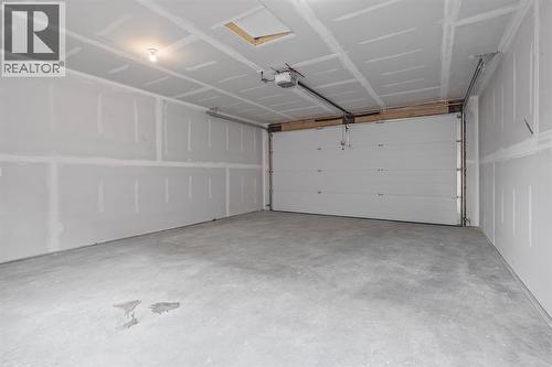 383 Caledonia Boulevard W, Lethbridge, AB - Indoor Photo Showing Garage