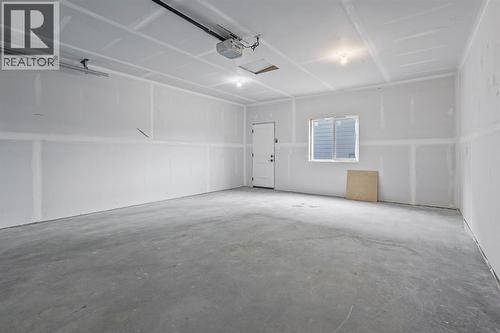 383 Caledonia Boulevard W, Lethbridge, AB - Indoor Photo Showing Garage