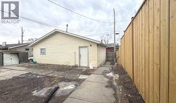 Triple garage and newer fence on the west side - 