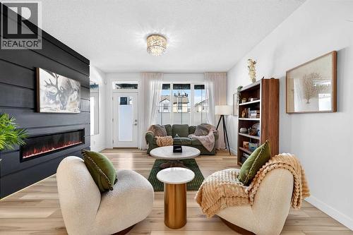 47 Walgrove Park Se, Calgary, AB - Indoor Photo Showing Living Room With Fireplace