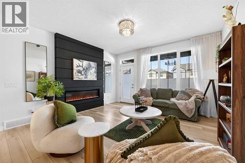 47 Walgrove Park Se, Calgary, AB - Indoor Photo Showing Living Room With Fireplace