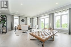 Living area featuring crown molding, light wood finished floors, and recessed lighting - 