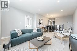 Living area featuring a chandelier and recessed lighting - 