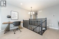 Office featuring a chandelier - 