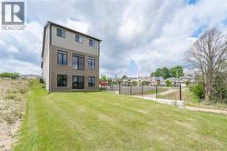 Back of house with brick siding and a residential view - 