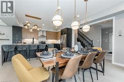 Dining area featuring stairway and recessed lighting - 