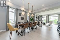 Dining area featuring recessed lighting and light wood-style flooring - 