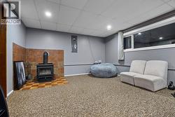 basement rec room with wood stove - 