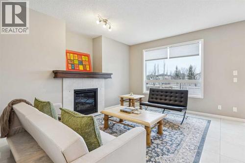 71 Walden Manor Se, Calgary, AB - Indoor Photo Showing Living Room With Fireplace