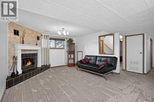 16 Rundleson Way Ne, Calgary, AB - Indoor Photo Showing Other Room With Fireplace
