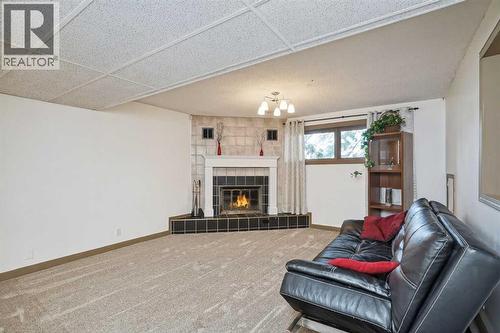 16 Rundleson Way Ne, Calgary, AB - Indoor Photo Showing Living Room With Fireplace