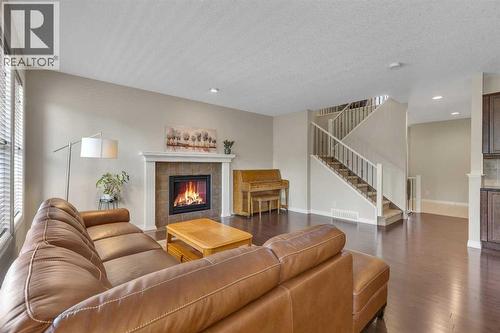 224 Panamount Point Nw, Calgary, AB - Indoor Photo Showing Living Room With Fireplace