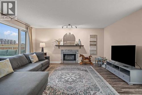 43 Sunset Crescent, Okotoks, AB - Indoor Photo Showing Living Room With Fireplace
