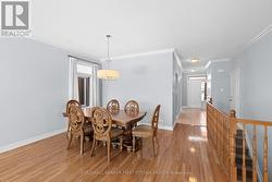Dining area w hanging fixture & access to basement - 