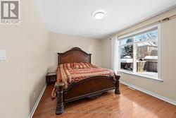 Primary bedroom w expansive window facing the yard - 