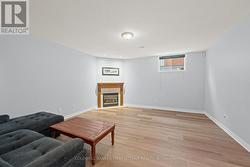 Basement recreation room includes gas fireplace! - 