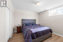 Bedroom w full egress window & walk in closet. - 