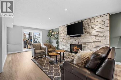 123 Sackville Drive Sw, Calgary, AB - Indoor Photo Showing Living Room With Fireplace