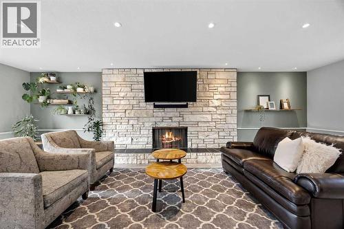 123 Sackville Drive Sw, Calgary, AB - Indoor Photo Showing Living Room With Fireplace