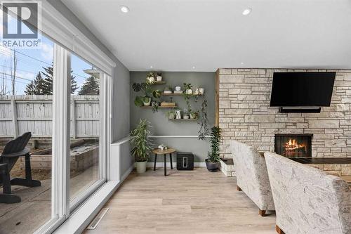 123 Sackville Drive Sw, Calgary, AB - Indoor With Fireplace