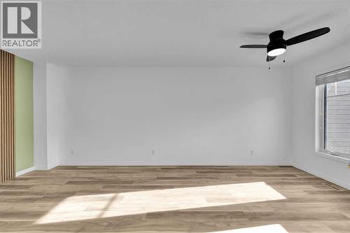 sun-filled dinning/living room - 169 Windstone Park Sw, Airdrie, AB - Indoor Photo Showing Other Room