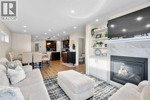 17 Cranford Place Se, Calgary, AB - Indoor Photo Showing Living Room With Fireplace