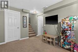 Rec Room and Door to future bathroom (currently used as storage) - 