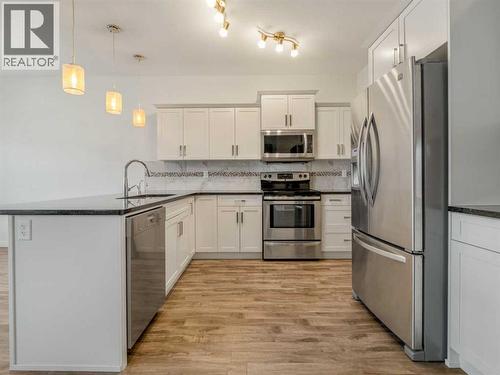 98 Moonlight Boulevard W, Lethbridge, AB - Indoor Photo Showing Kitchen With Stainless Steel Kitchen With Upgraded Kitchen