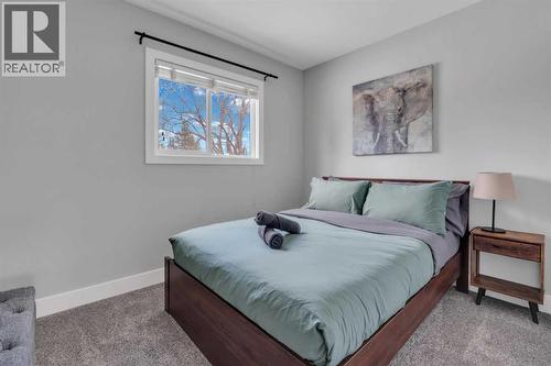 19 Garrick Drive Sw, Calgary, AB - Indoor Photo Showing Bedroom
