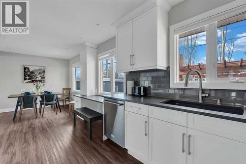 19 Garrick Drive Sw, Calgary, AB - Indoor Photo Showing Kitchen With Double Sink