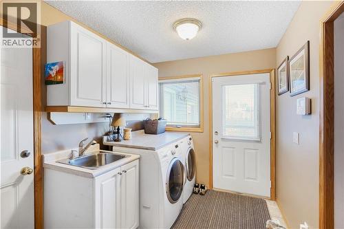272210 Range Road 291  Ne, Airdrie, AB - Indoor Photo Showing Laundry Room