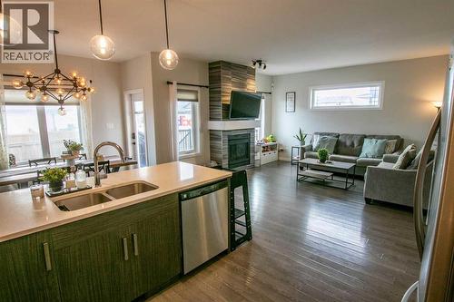 128 Cabot Landing W, Lethbridge, AB - Indoor With Fireplace