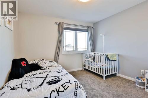 128 Cabot Landing W, Lethbridge, AB - Indoor Photo Showing Bedroom