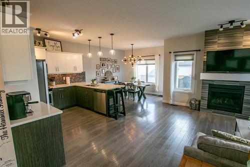 128 Cabot Landing W, Lethbridge, AB - Indoor With Fireplace