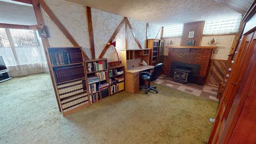227 9Th Avenue, Cranbrook, BC - Indoor Photo Showing Other Room With Fireplace