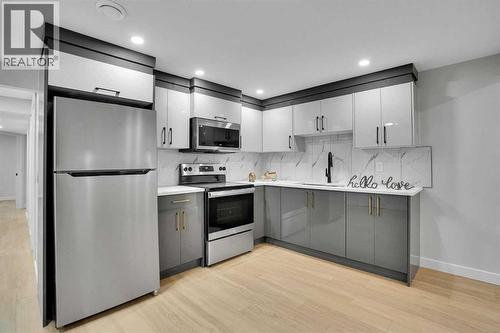 BASEMENT KITCHEN - 23 Shawmeadows Place Sw, Calgary, AB - Indoor Photo Showing Kitchen With Stainless Steel Kitchen