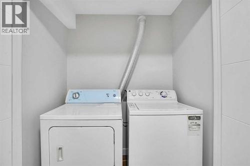 BASEMENT LAUNDRY - 23 Shawmeadows Place Sw, Calgary, AB - Indoor Photo Showing Laundry Room