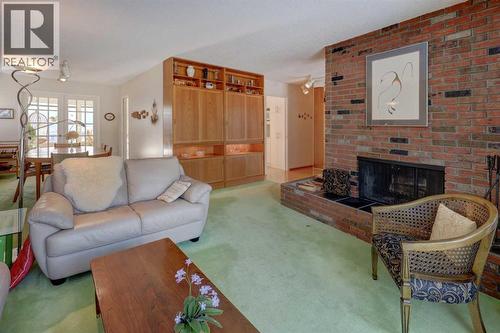 5943 Silver Ridge Drive Nw, Calgary, AB - Indoor Photo Showing Living Room With Fireplace