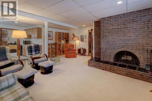 5943 Silver Ridge Drive Nw, Calgary, AB - Indoor Photo Showing Living Room With Fireplace