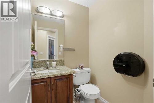 Main floor 2 piece washroom - 197 West Creek Boulevard, Chestermere, AB - Indoor Photo Showing Bathroom