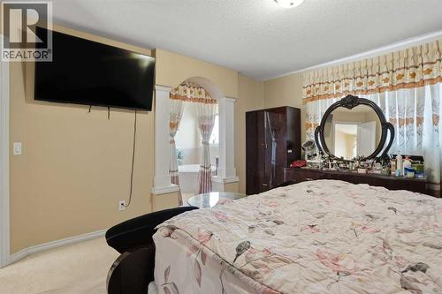 Primary Bedroom looking towards ensuite - 197 West Creek Boulevard, Chestermere, AB - Indoor Photo Showing Bedroom