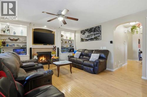Family room - 197 West Creek Boulevard, Chestermere, AB - Indoor Photo Showing Living Room With Fireplace