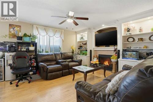 Family room - 197 West Creek Boulevard, Chestermere, AB - Indoor Photo Showing Living Room With Fireplace