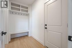 Mudroom with wooden bench and built-in lockers - 