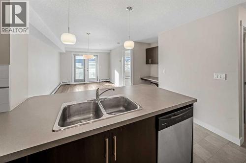 304, 2300 Evanston Square Nw, Calgary, AB - Indoor Photo Showing Kitchen With Double Sink