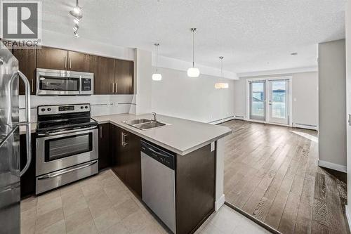 304, 2300 Evanston Square Nw, Calgary, AB - Indoor Photo Showing Kitchen With Double Sink With Upgraded Kitchen