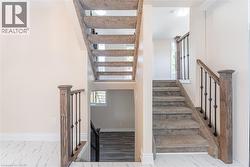 Stairway featuring marble look tile flooring - 